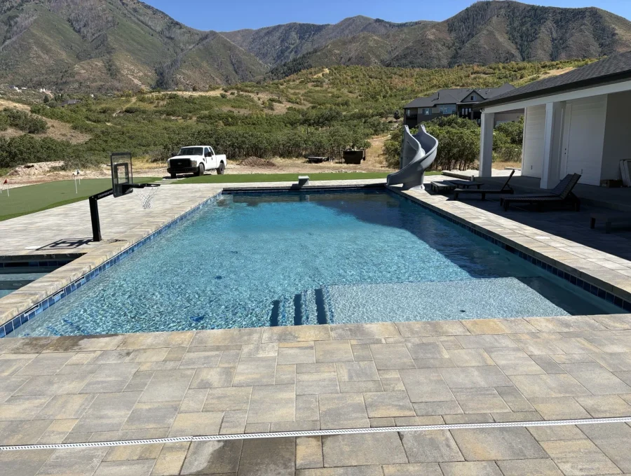 Sheer descent water feature pouring from a raised spa wall
