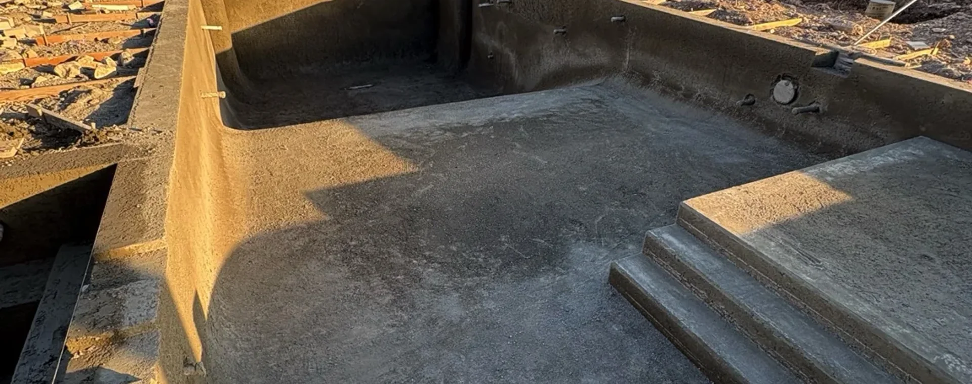 Gunite shell construction for a custom swimming pool with mountain views in Elk Ridge, Utah.