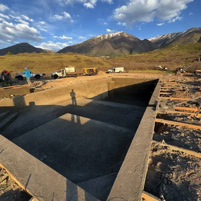 Custom gunite swimming pool under construction with mountain views in Elk Ridge, Utah.